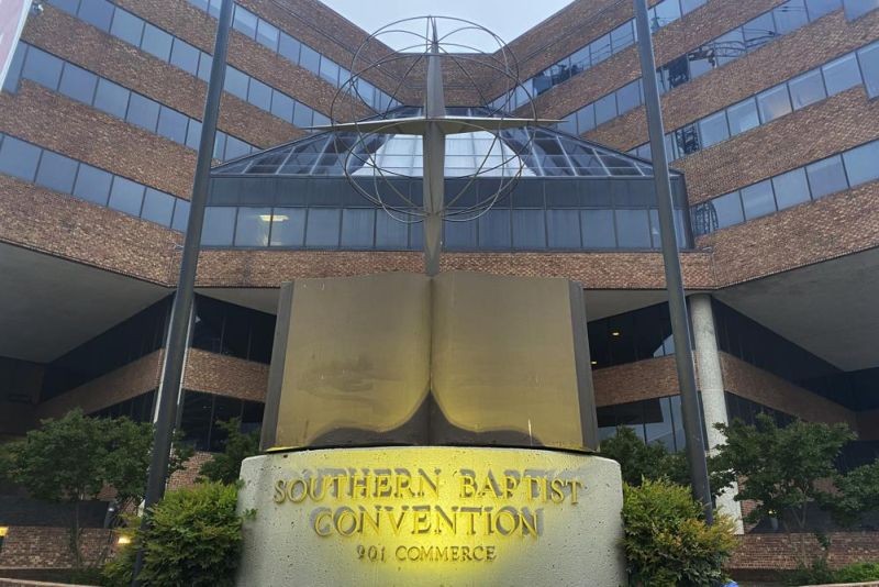 A cross and Bible sculpture stand outside the Southern Baptist Convention headquarters in Nashville, Tenn., on May 24, 2022. (AP Photo)